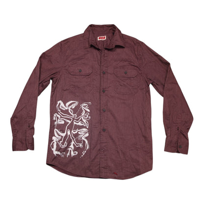 Maroon shirt with white graphic design on a white background